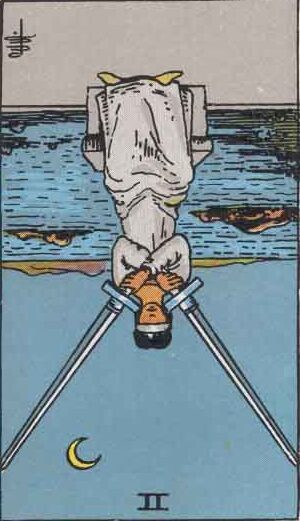 Two of Swords Reversed Meaning